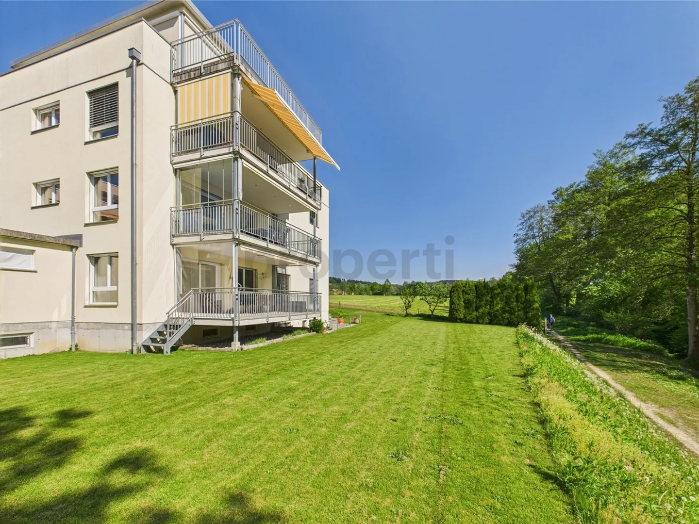 Enjoy the peace and the view of greenery from the large balcony of your new home - Photo 1 of 10