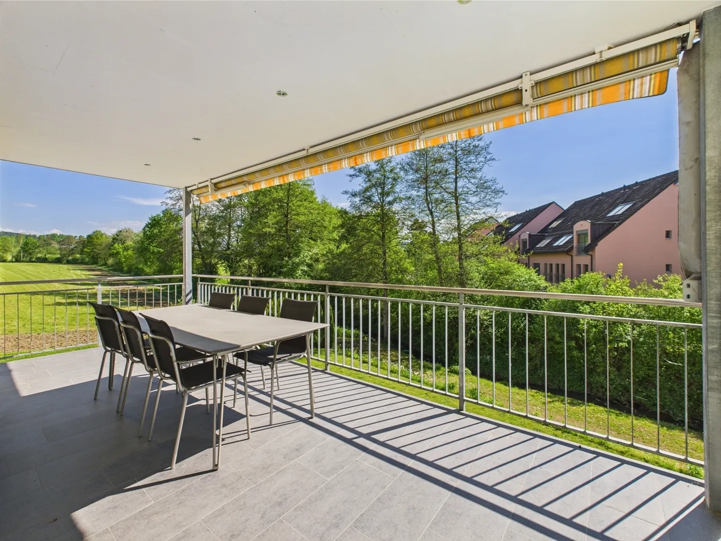 Enjoy the peace and the view of greenery from the large balcony of your new home - Photo 2 of 10