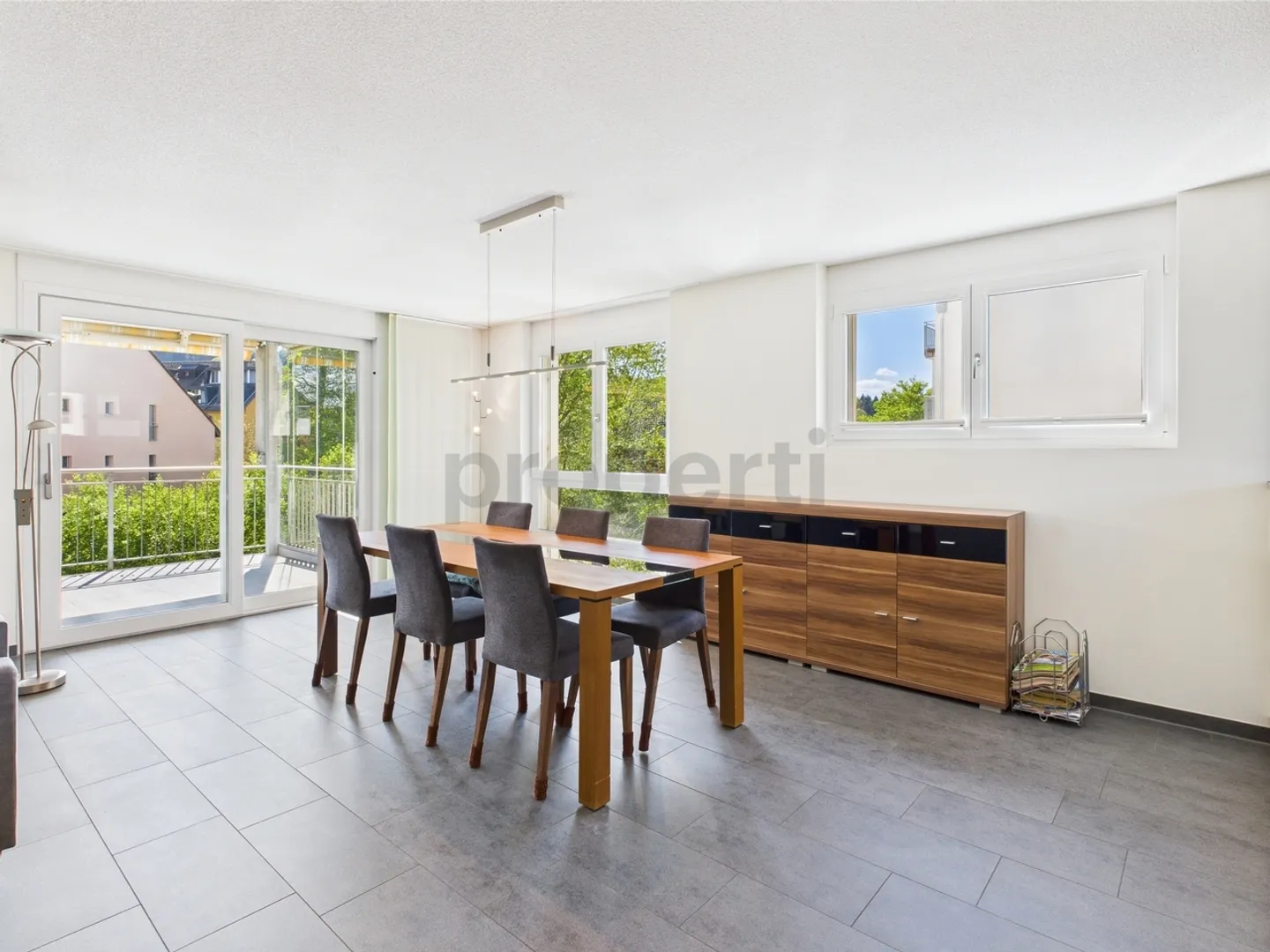 Enjoy the peace and the view of greenery from the large balcony of your new home - Photo 5 of 10