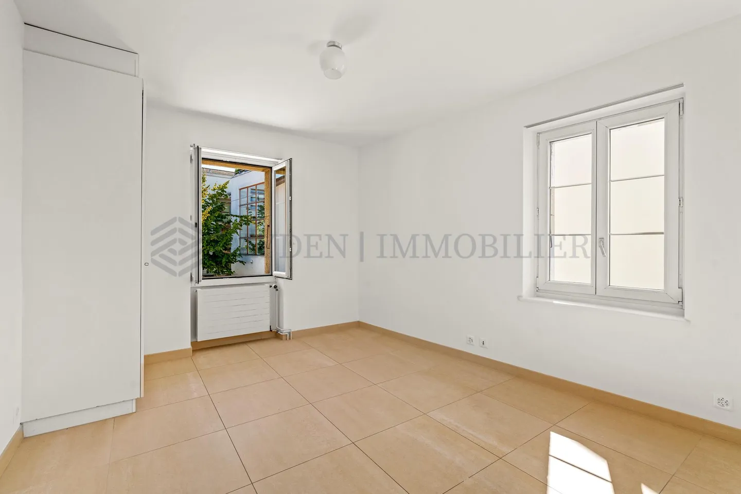 Mixed-Use Building in Bernex - Photo 4 of 17