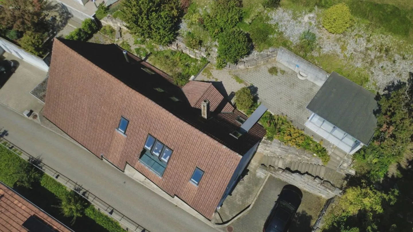 Exclusive Residential Idyl: Charming Farmhouse on Southern Slope with Great Potential in Oensingen - Photo 1 of 25