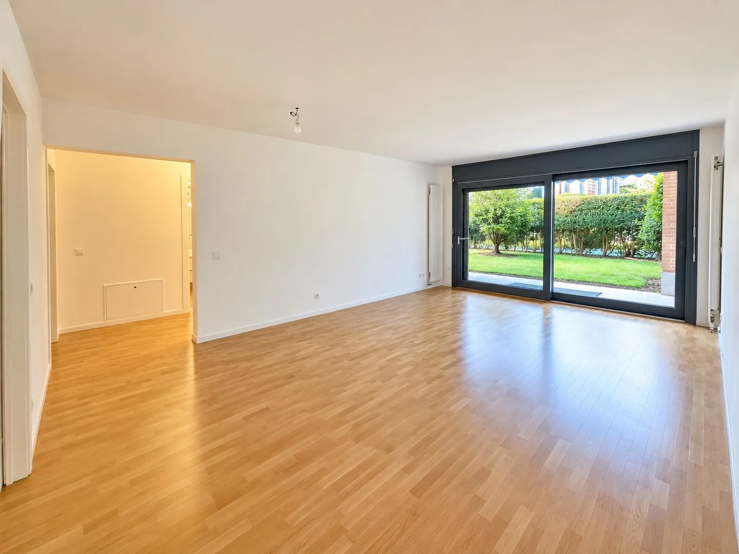 Geräumige Wohnung mit Garten - Foto 4 von 14