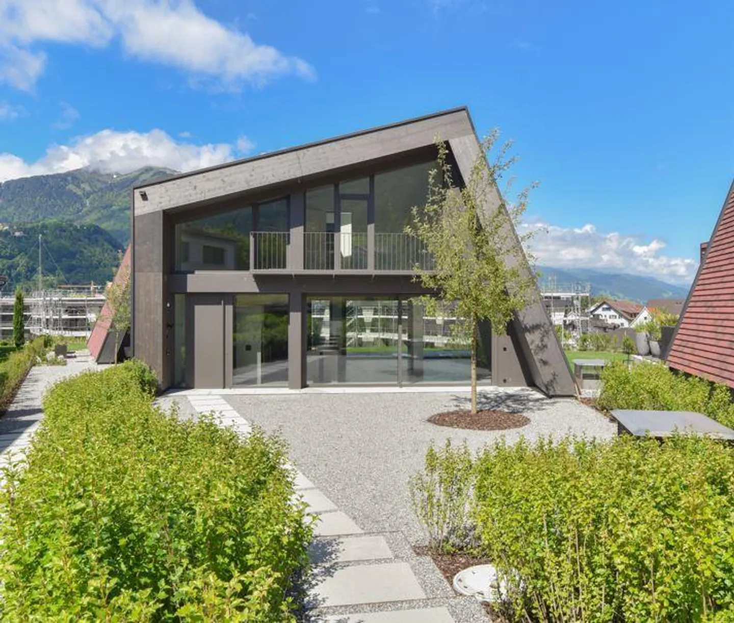 Modern single-family home including 3 parking spaces in TG - sunny, quiet, and in the middle of Maienfeld - Photo 1 of 19