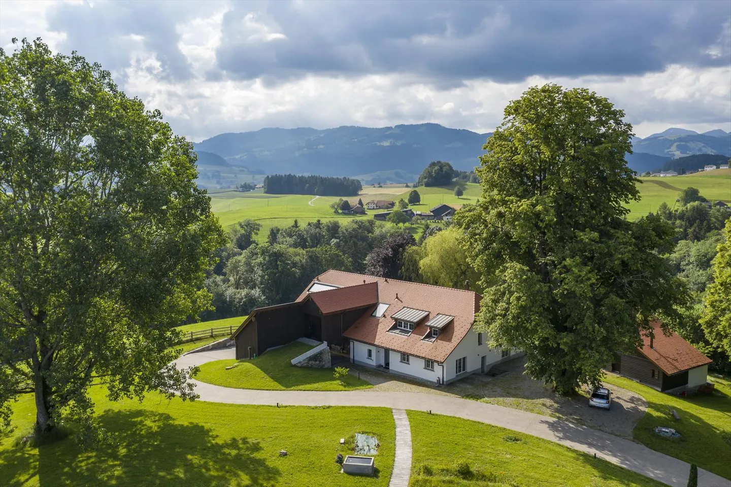 Rare on the Market! Prestigious Farmhouse with Outbuilding, View and Absolute Comfort - Photo 1 of 12