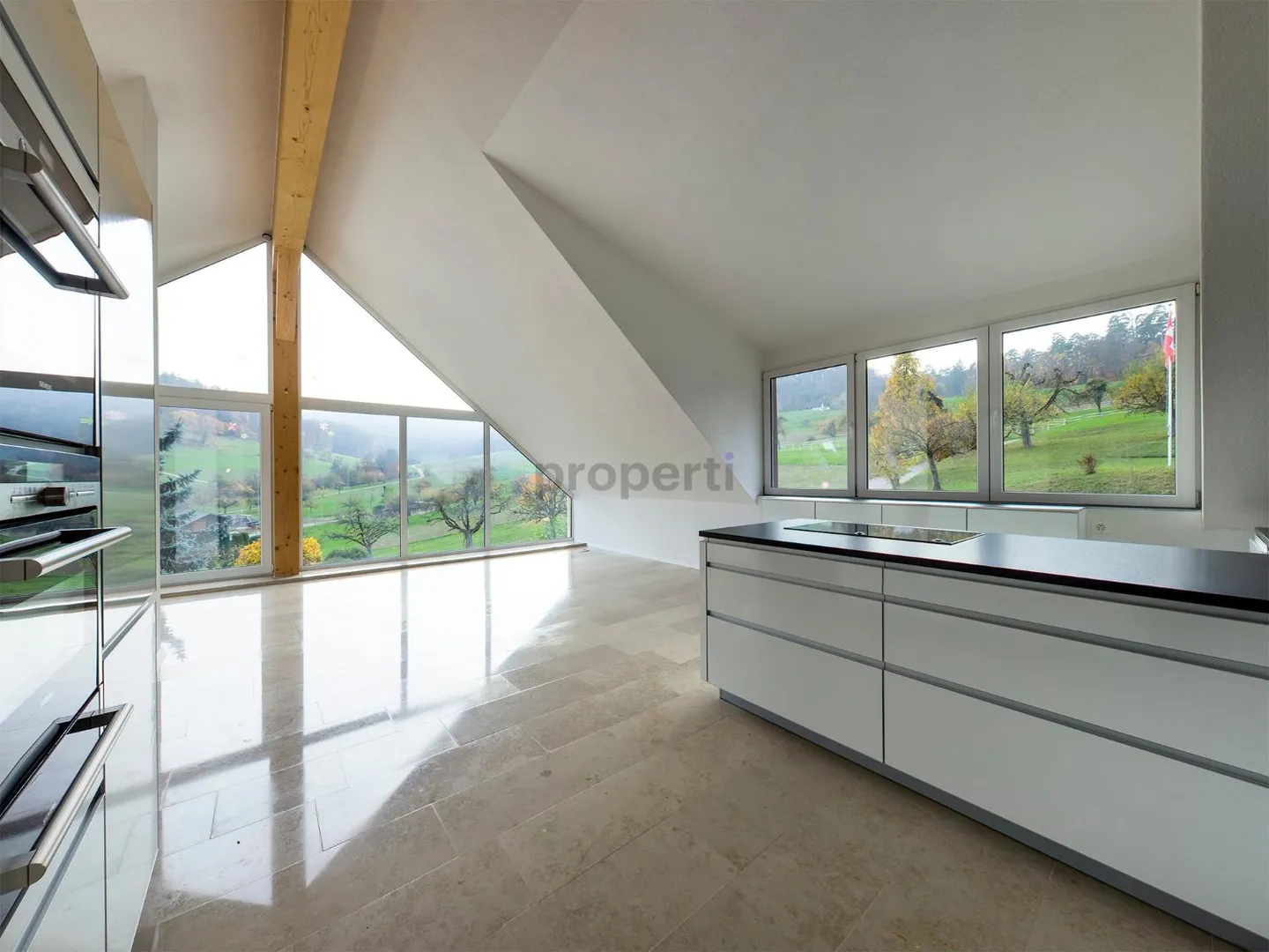 Light-Filled Dream Home in Weiach: Stylish 3.5-Room Attic Apartment with High Ceilings and Great Views - Photo 2 of 13