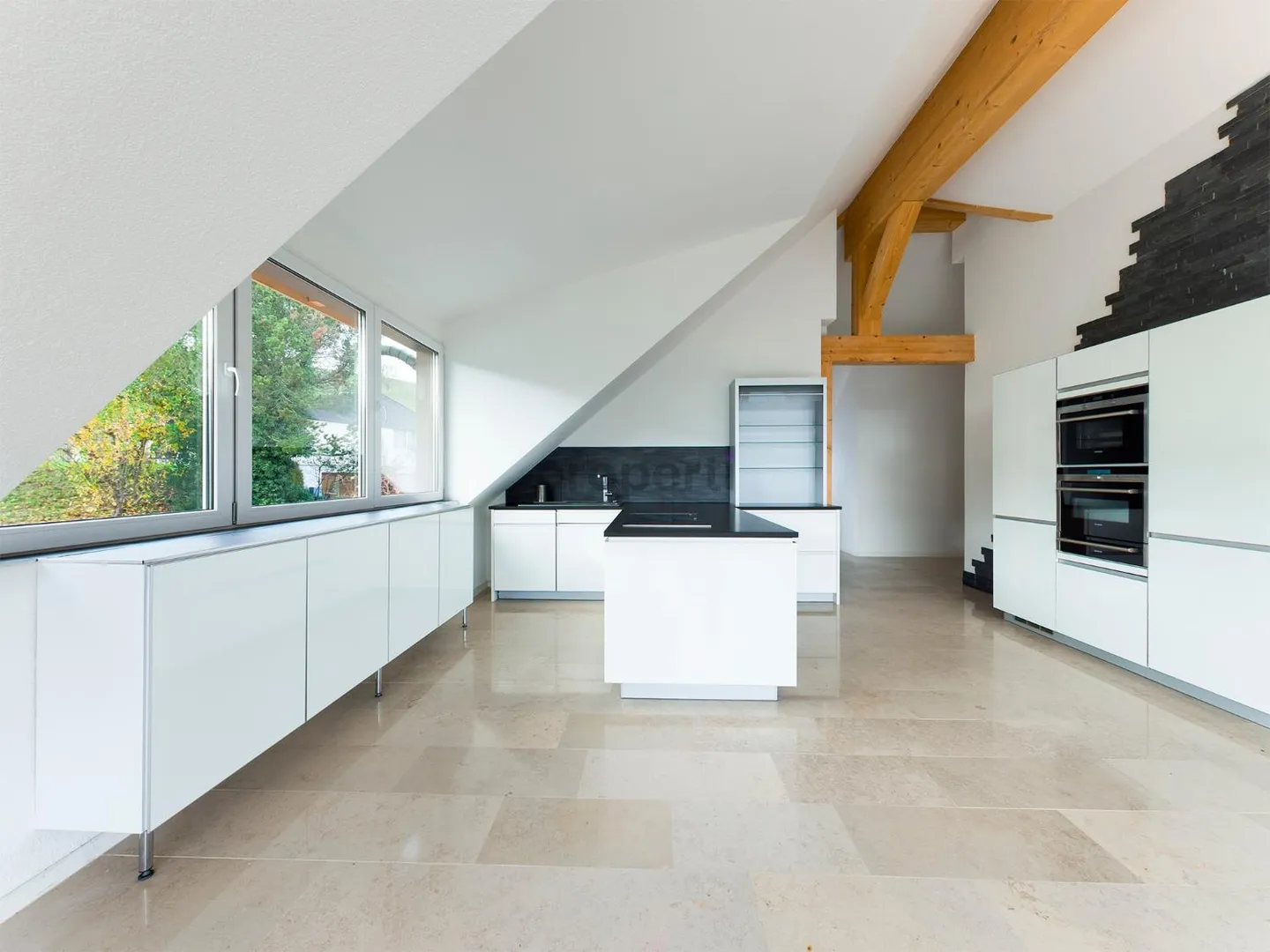 Light-Filled Dream Home in Weiach: Stylish 3.5-Room Attic Apartment with High Ceilings and Great Views - Photo 6 of 13