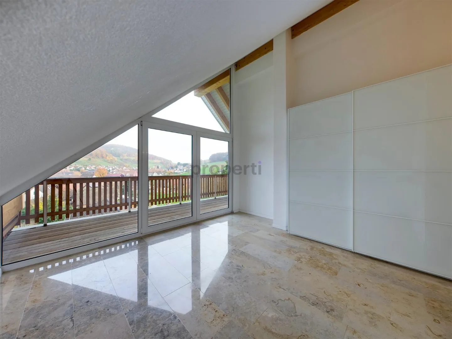 Light-Filled Dream Home in Weiach: Stylish 3.5-Room Attic Apartment with High Ceilings and Great Views - Photo 8 of 13