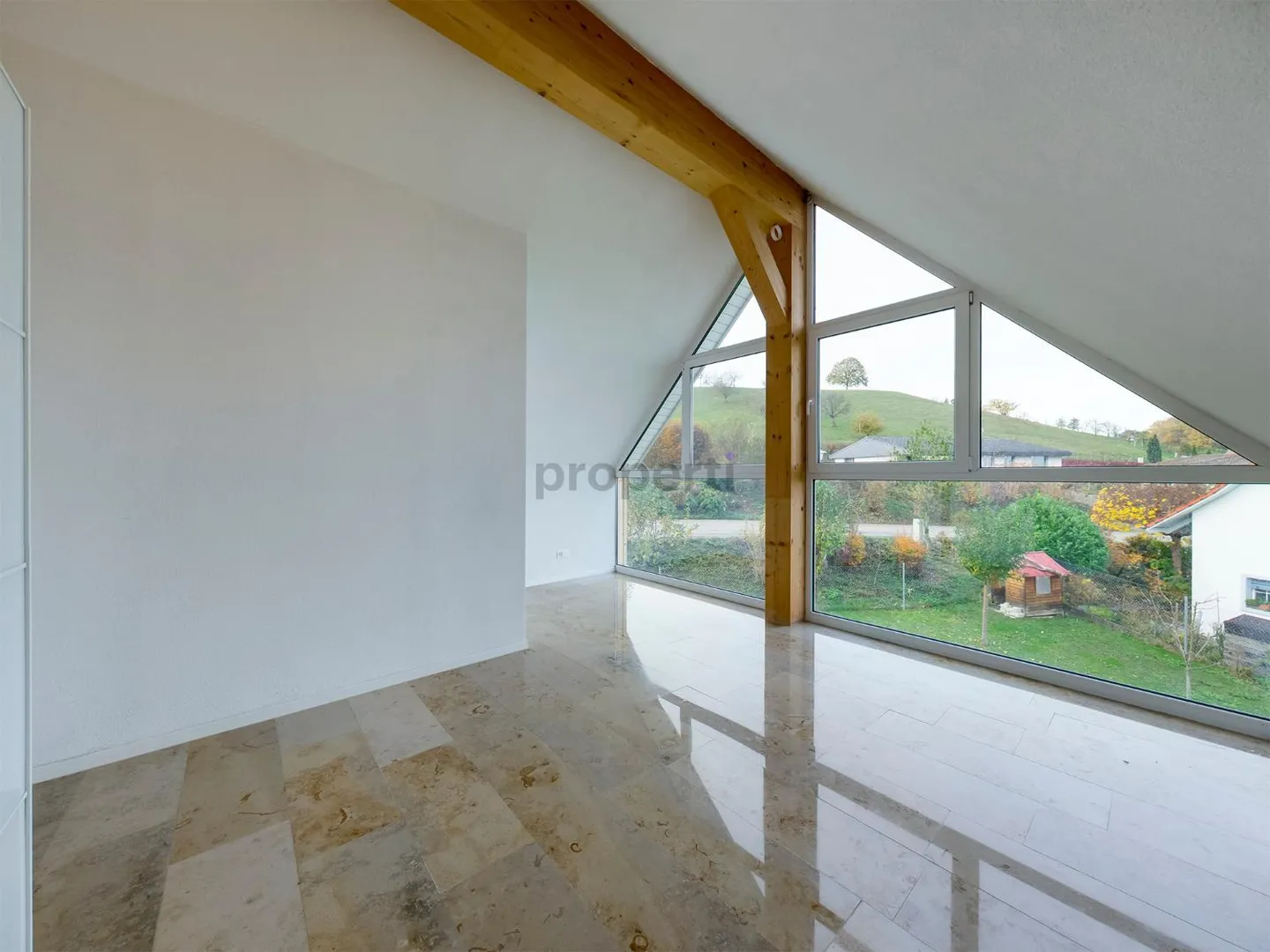 Light-Filled Dream Home in Weiach: Stylish 3.5-Room Attic Apartment with High Ceilings and Great Views - Photo 9 of 13