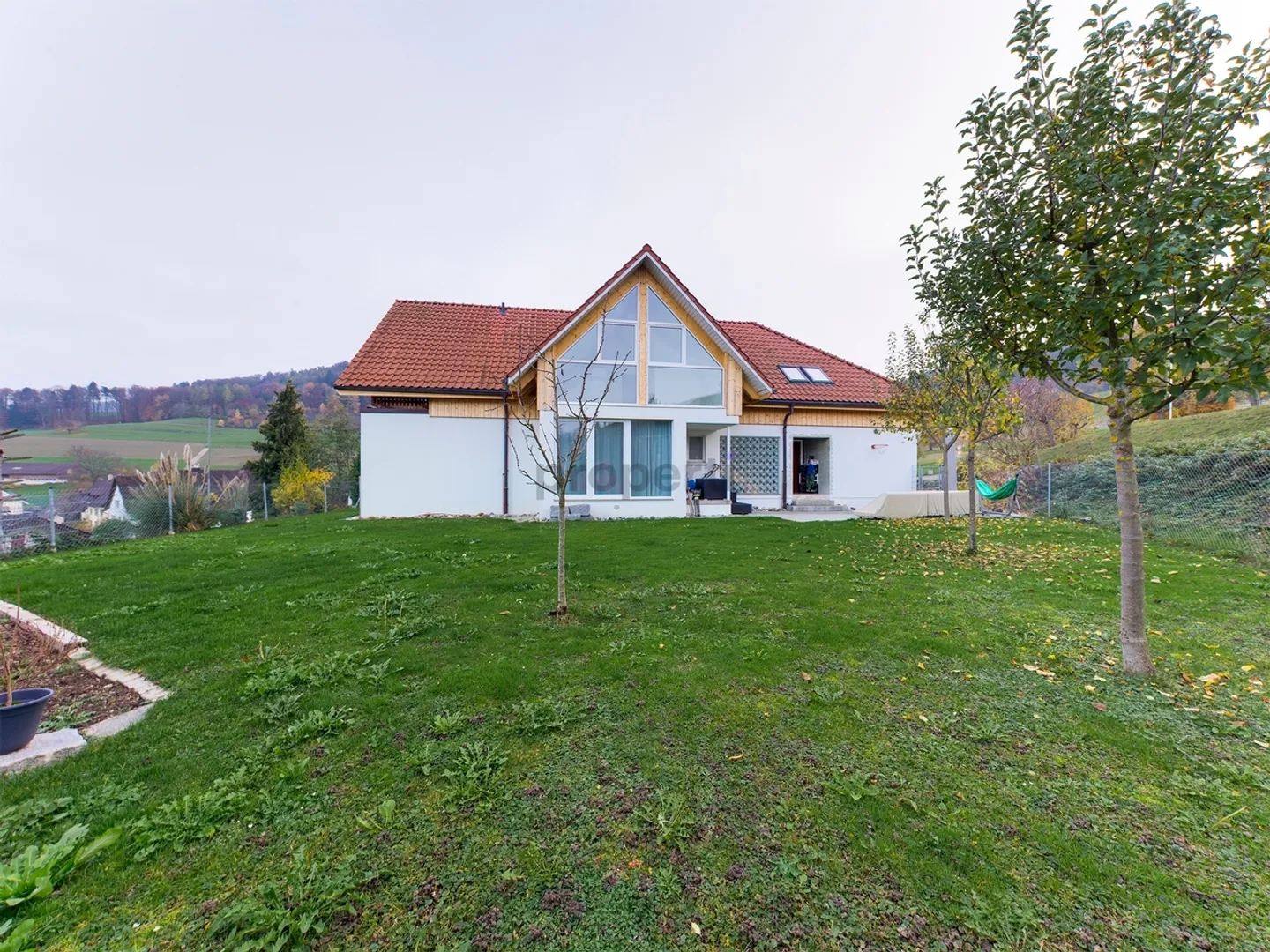 Light-Filled Dream Home in Weiach: Stylish 3.5-Room Attic Apartment with High Ceilings and Great Views - Photo 1 of 13