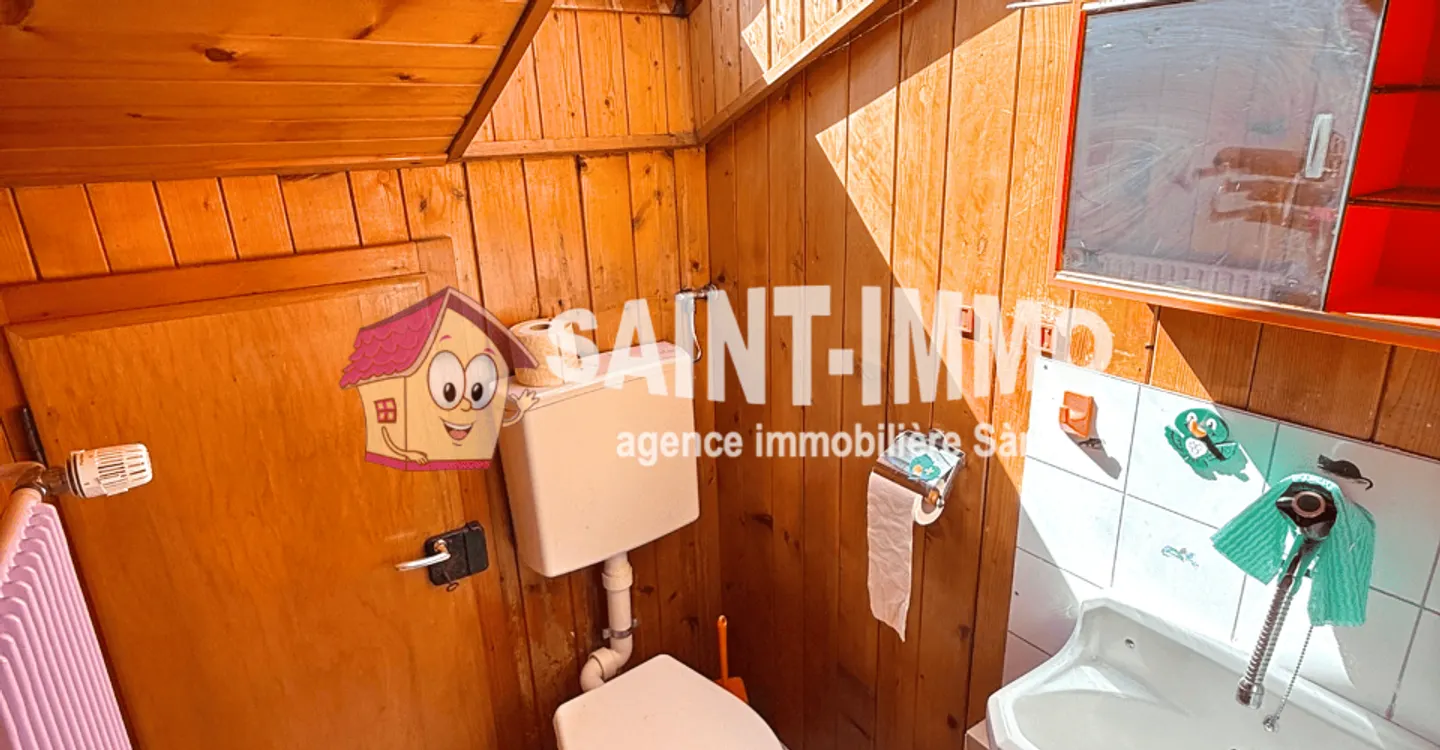 Chalet mit zwei Wohnungen (3 & 6,5 Zimmer) mit einem 840 m2 großen Garten, Terrasse und Garagen - Foto 18 von 23