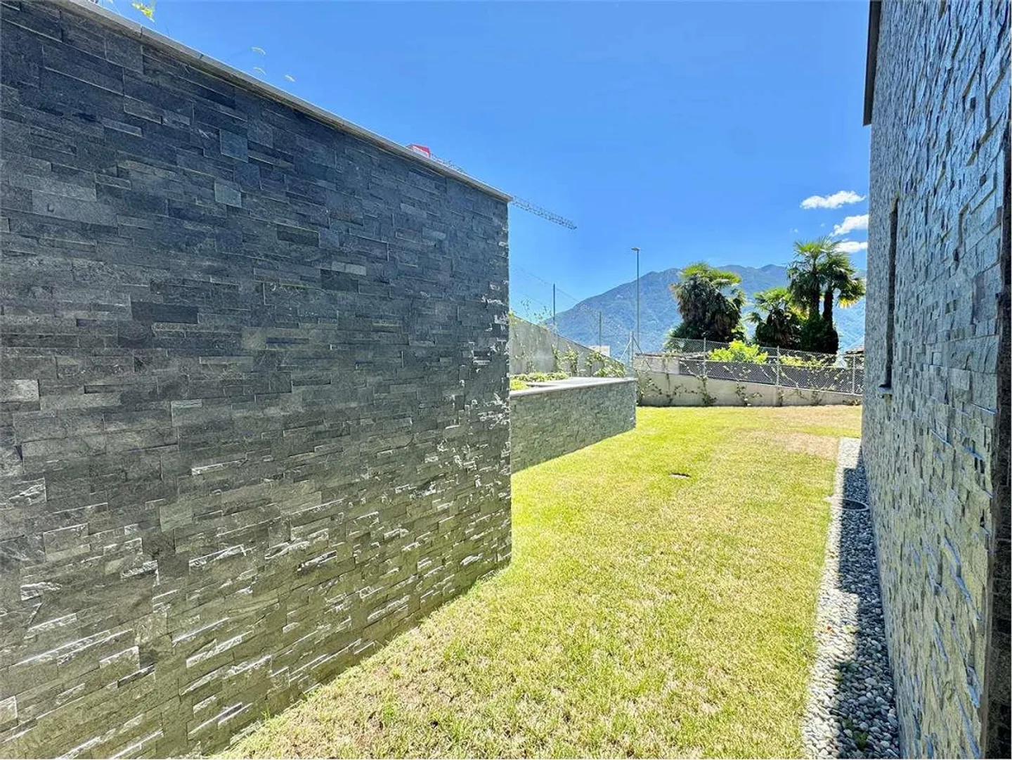 Appartamento 3,5 locali con giardino NUOVO Minusio vista lago al piano terra - Foto 2 di 13
