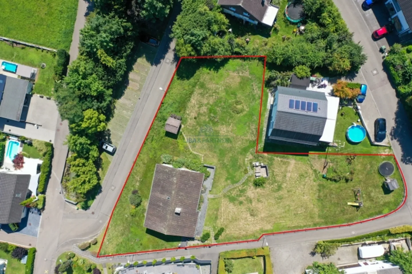 «Bauland mit bewilligtem Projekt für MFH & DEFH in Giebenach» - Foto 2 von 2