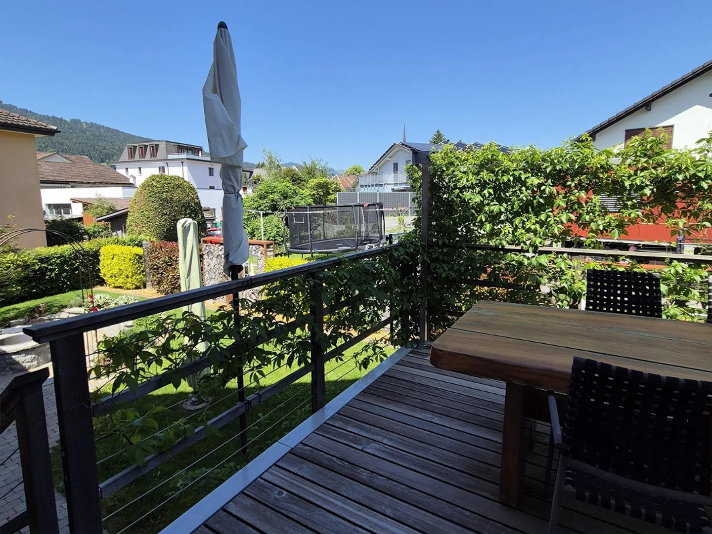 Maison individuelle avec garage, carport et jardin paysager - Photo 16 sur 16