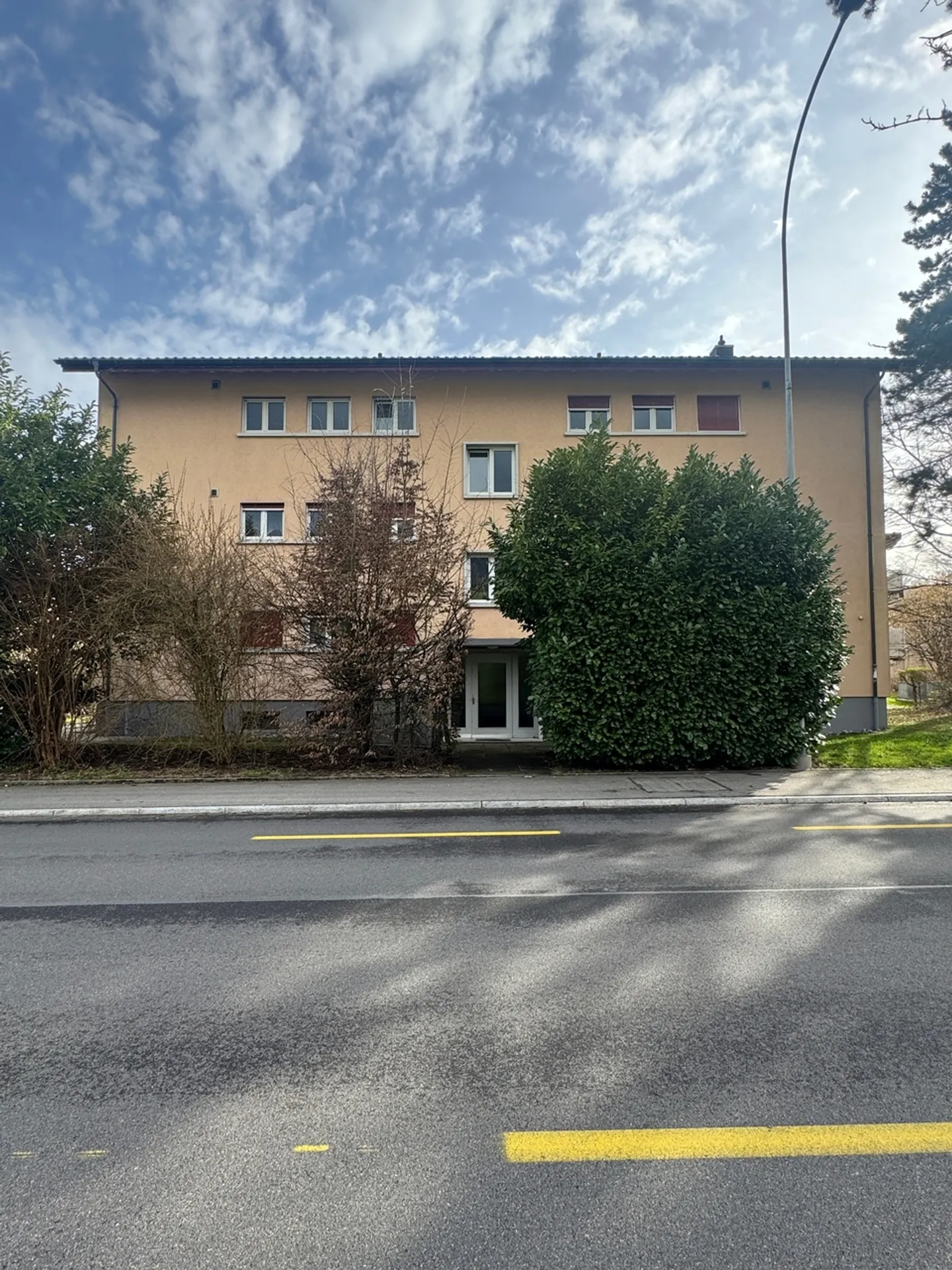 Well-maintained multi-family house with 6 residential units & 9 garages - Photo 1 of 13