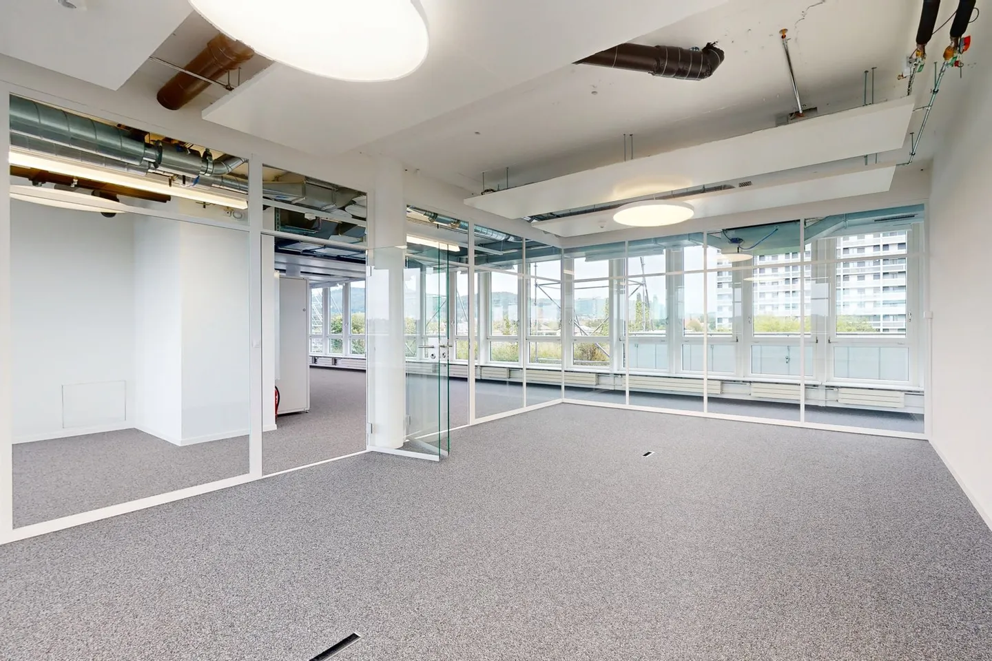 Freshly renovated office spaces with rooftop terrace, cooling ceilings, and great views! - Photo 6 of 11