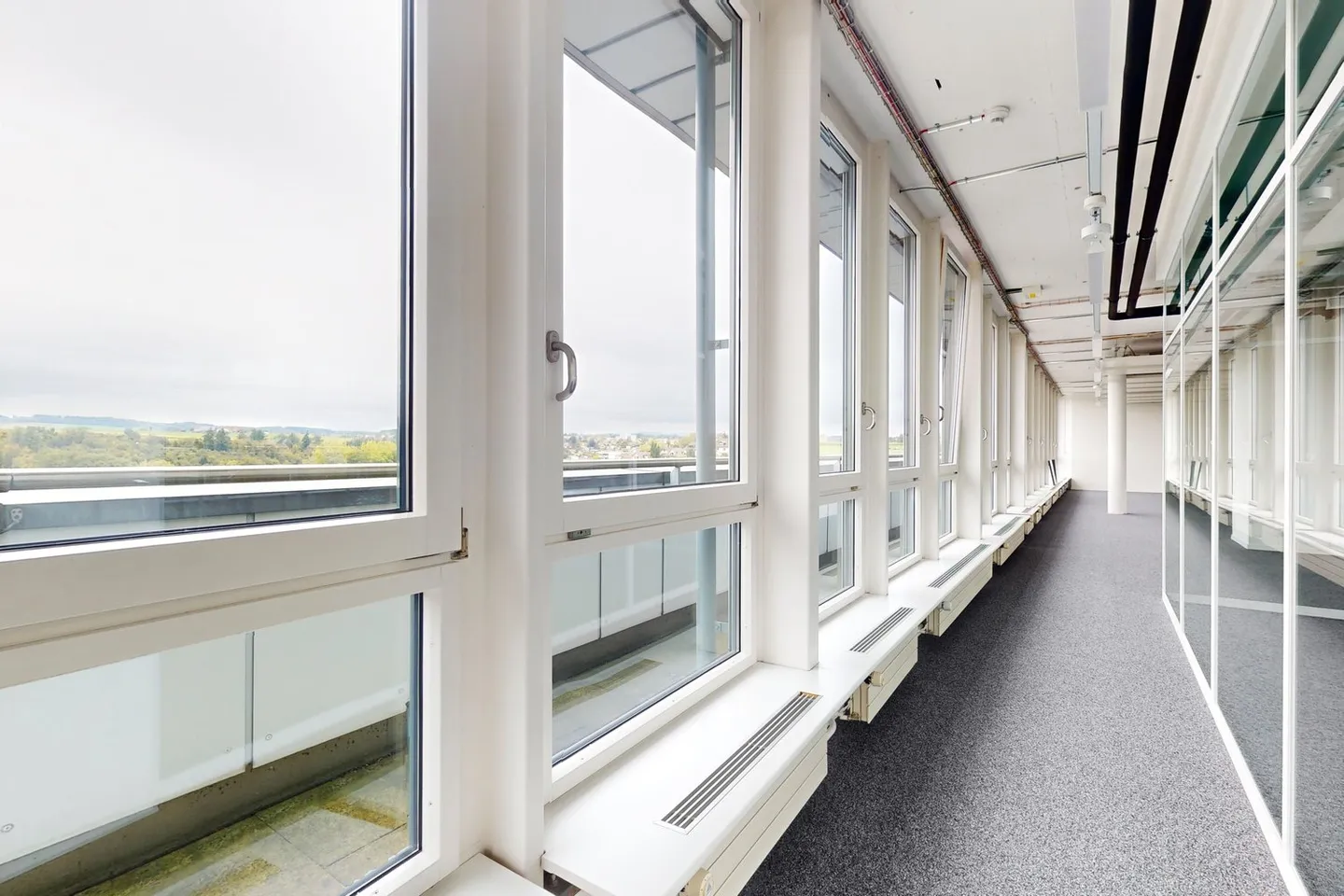 Freshly renovated office spaces with rooftop terrace, cooling ceilings, and great views! - Photo 9 of 11