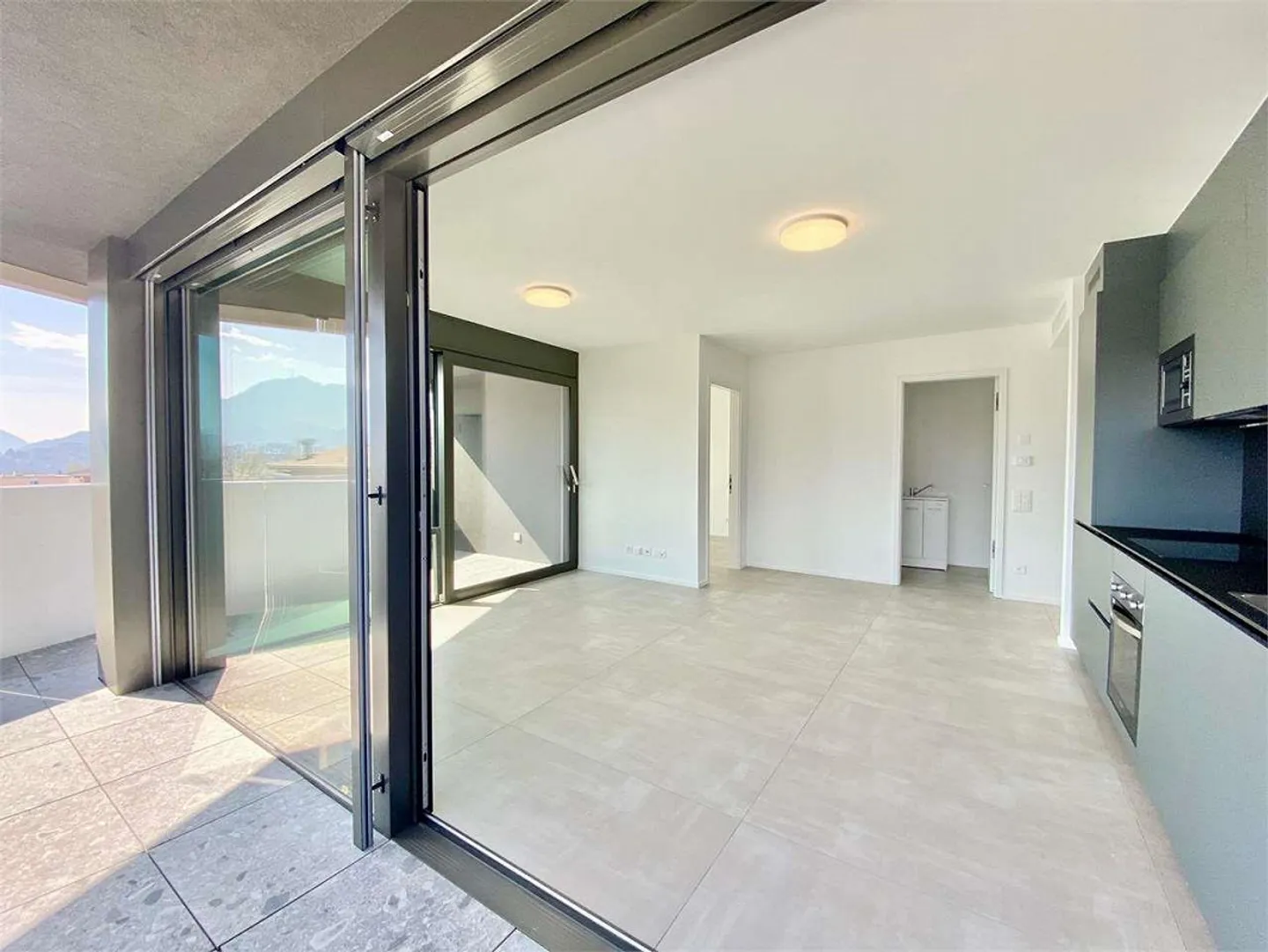 Elegant apartment with terrace in Breganzona new construction - Photo 1 of 13