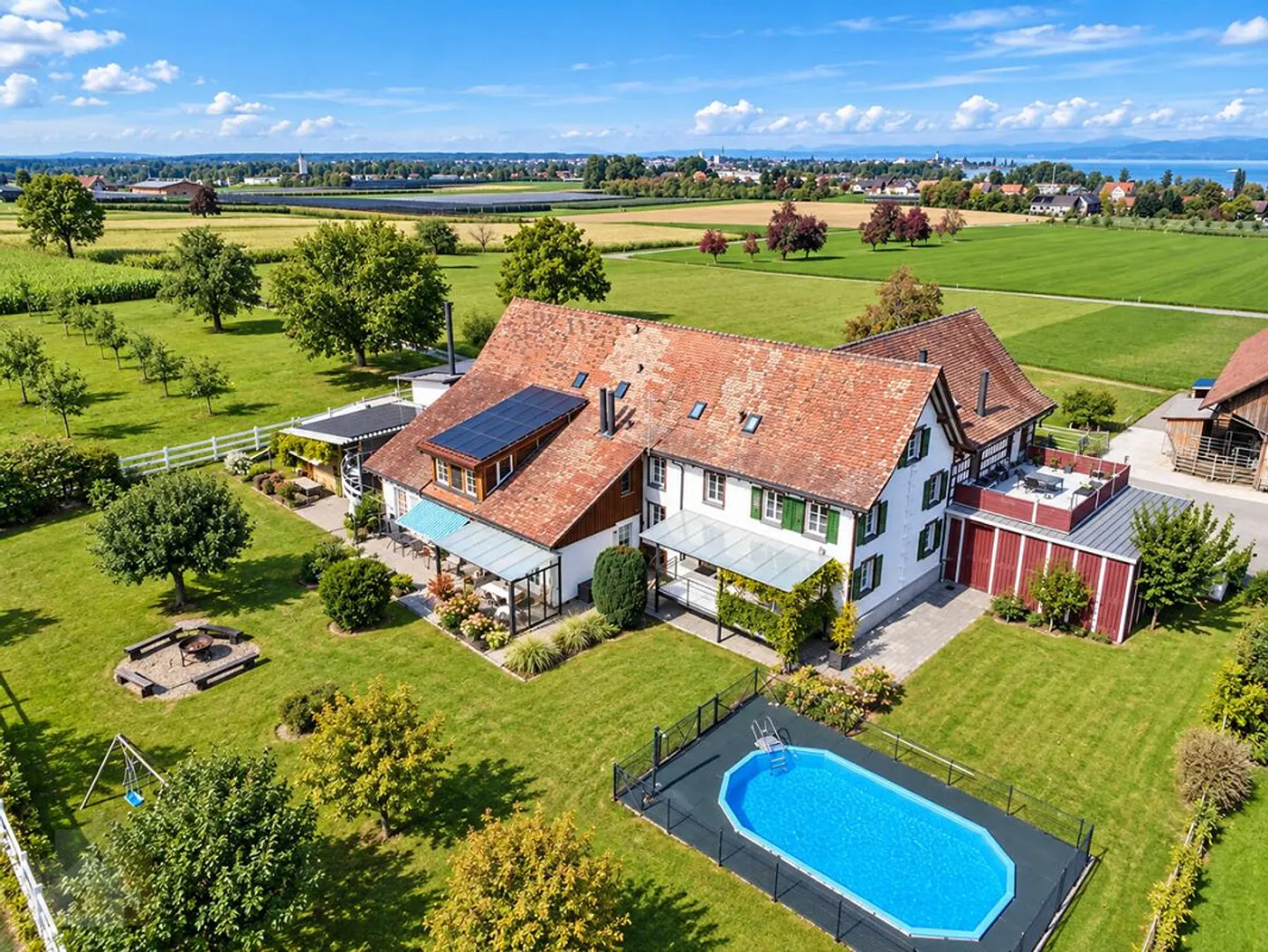 CHARACTERFUL & WELL-MAINTAINED MFH IN A UNIQUE LOCATION WITH POOL - Photo 1 of 12
