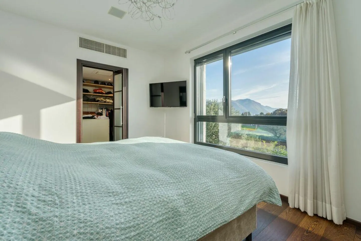 COMANO · MODERN VILLA WITH POOL AND ADVANCED HOME AUTOMATION - Photo 7 of 13