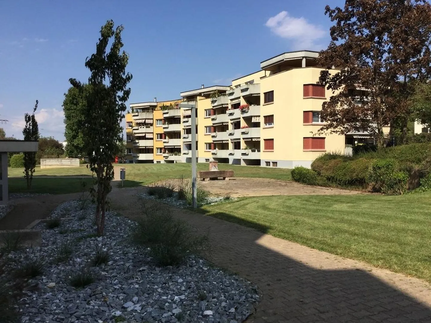 Balcony with evening sun and view of the well-kept green area - Photo 1 of 6