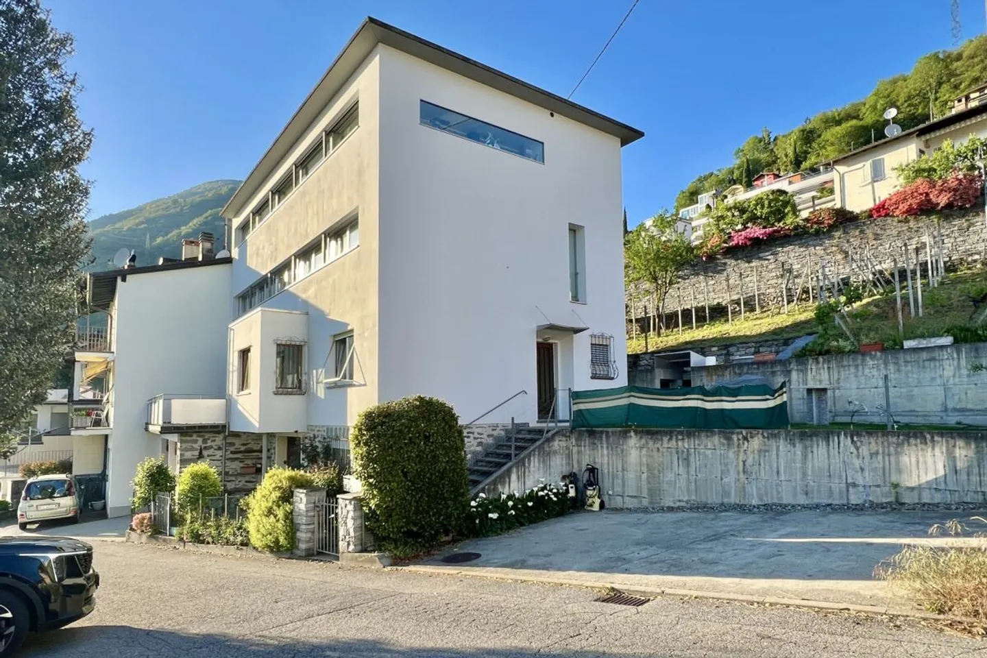 Appartamento 4,5 locali in una casa bifamiliare con vista lago a 180°, grande terrazza solare e giardino privato - Foto 38 di 50