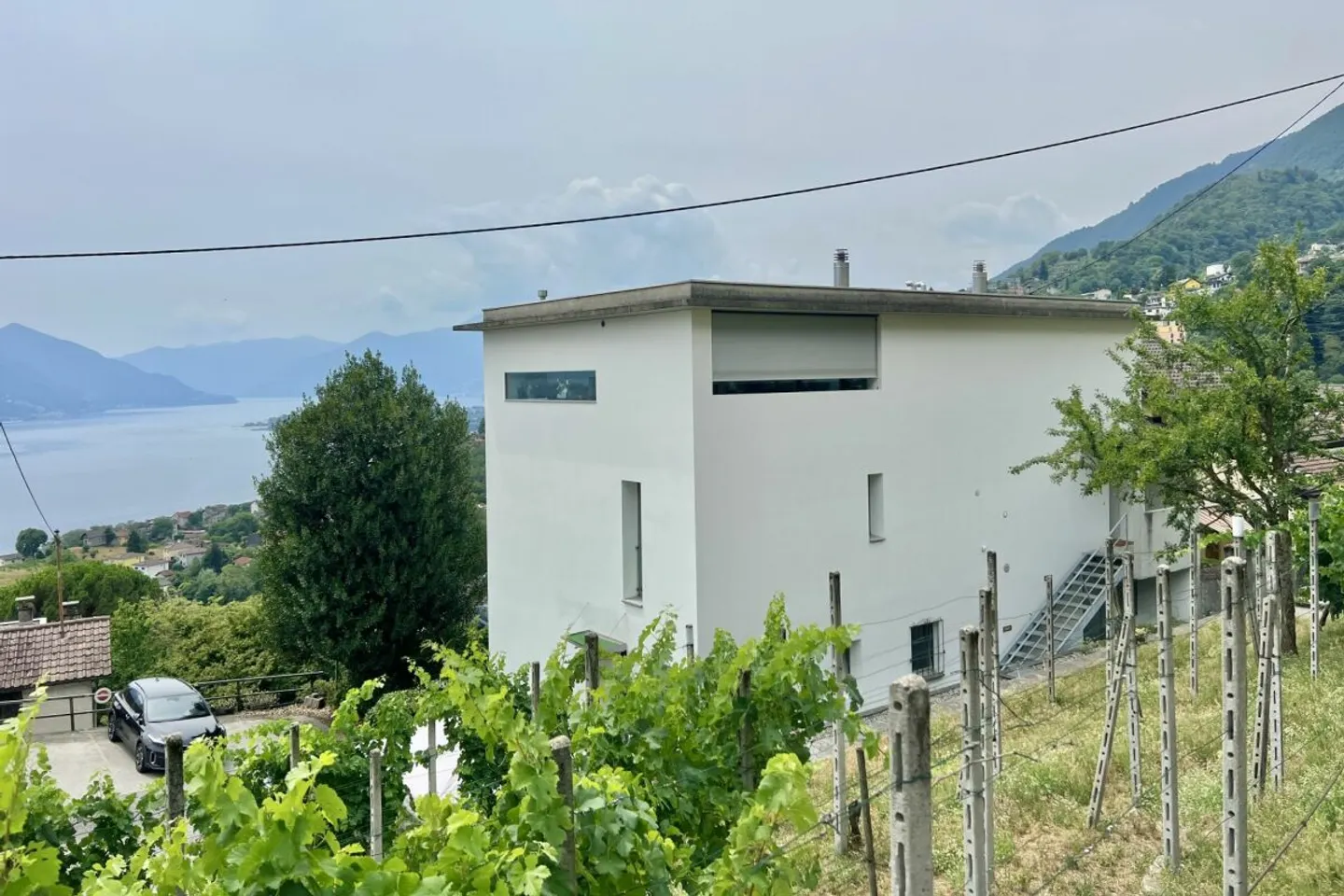 Appartamento 4,5 locali in una casa bifamiliare con vista lago a 180°, grande terrazza solare e giardino privato - Foto 41 di 50