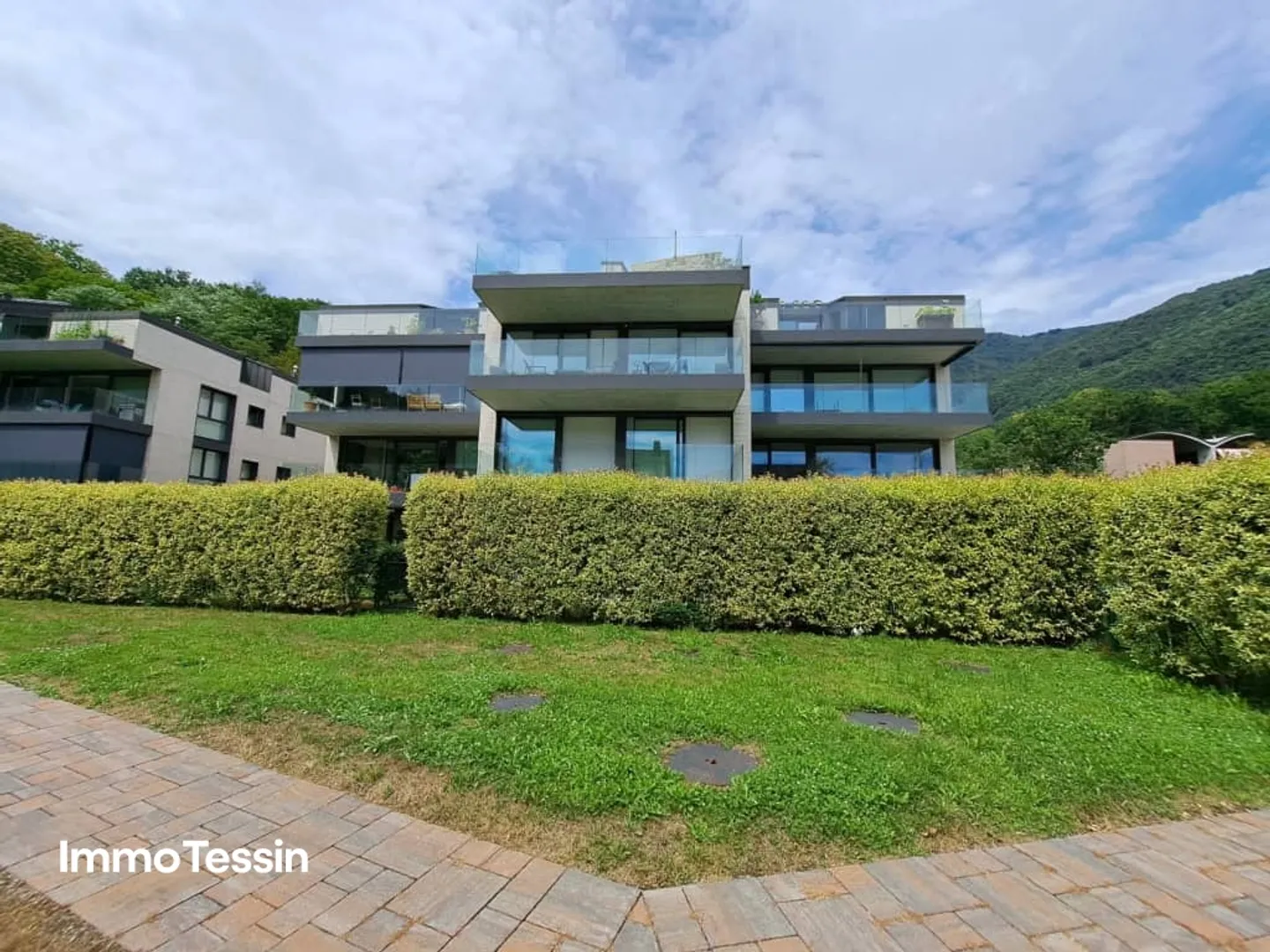 Exklusive & neuwertige Wohnung nahe Lugano und dem Lago die Lugano mit freier Sicht in die Tessiner Bergwelt - Foto 1 von 13