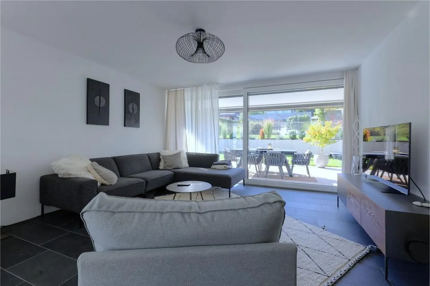 Modernes Apartment mit grossem Garten - Foto 1 von 13