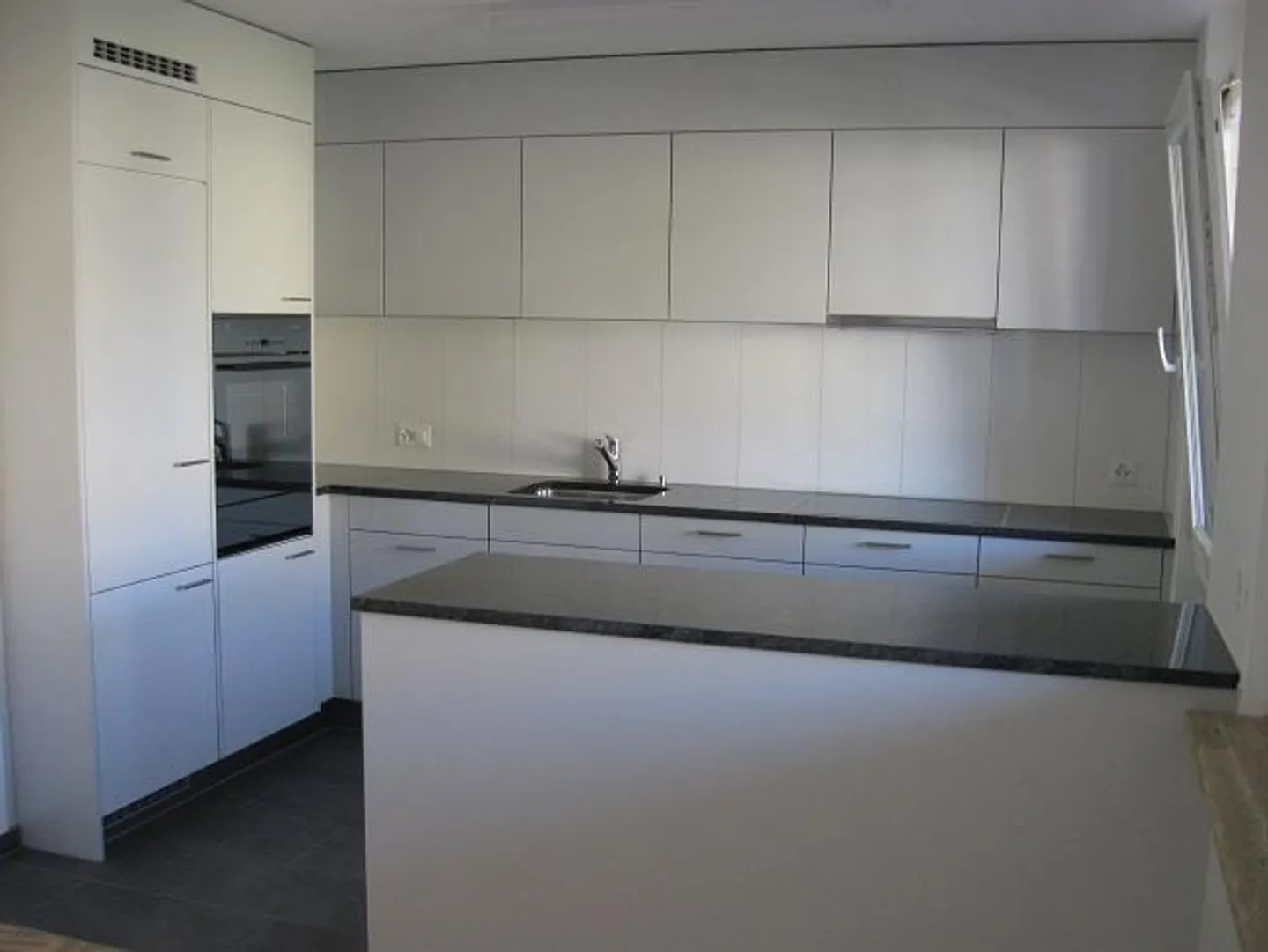 Balcony with evening sun, modern kitchen open to living room - Photo 4 of 9