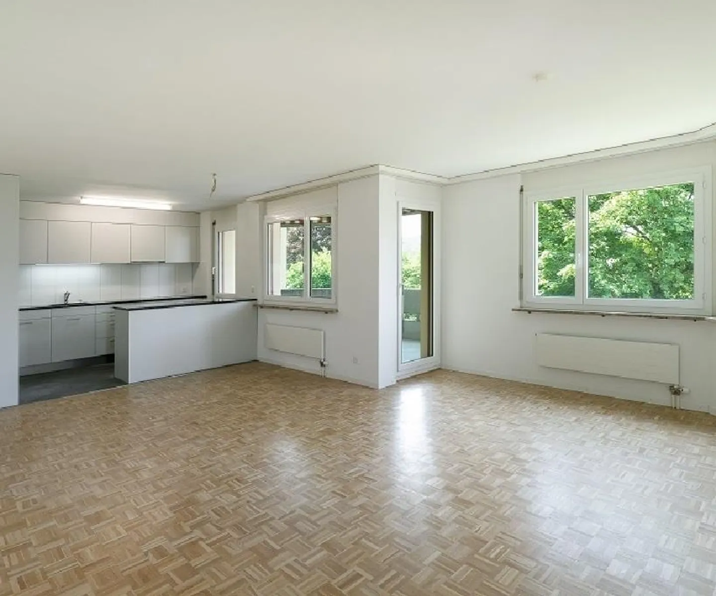Balcony with evening sun, modern kitchen open to living room - Photo 6 of 9