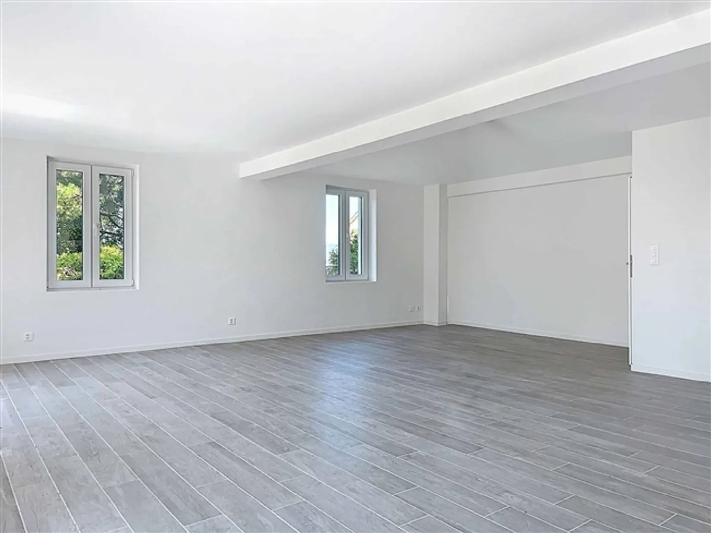 Triplex de trois pièces et demie - grand jardin et vue partielle sur le lac - Photo 4 sur 10