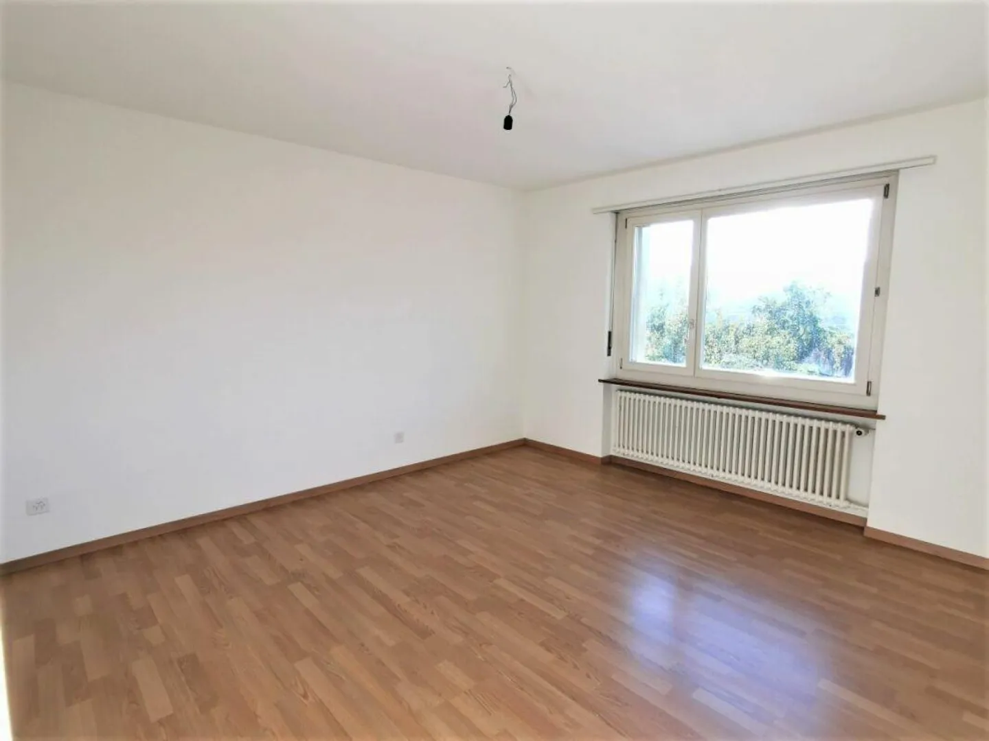 Appartement lumineux de 3 pièces au rez-de-chaussée surélevé - Photo 5 sur 8