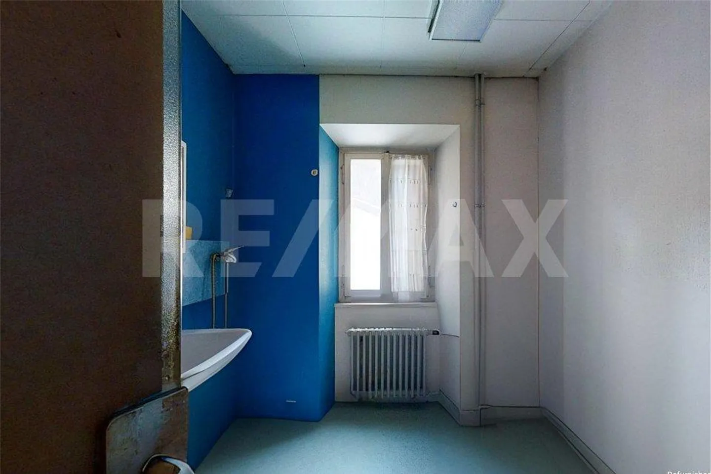Maison avec 3 appartements et magasin - Photo 6 sur 13