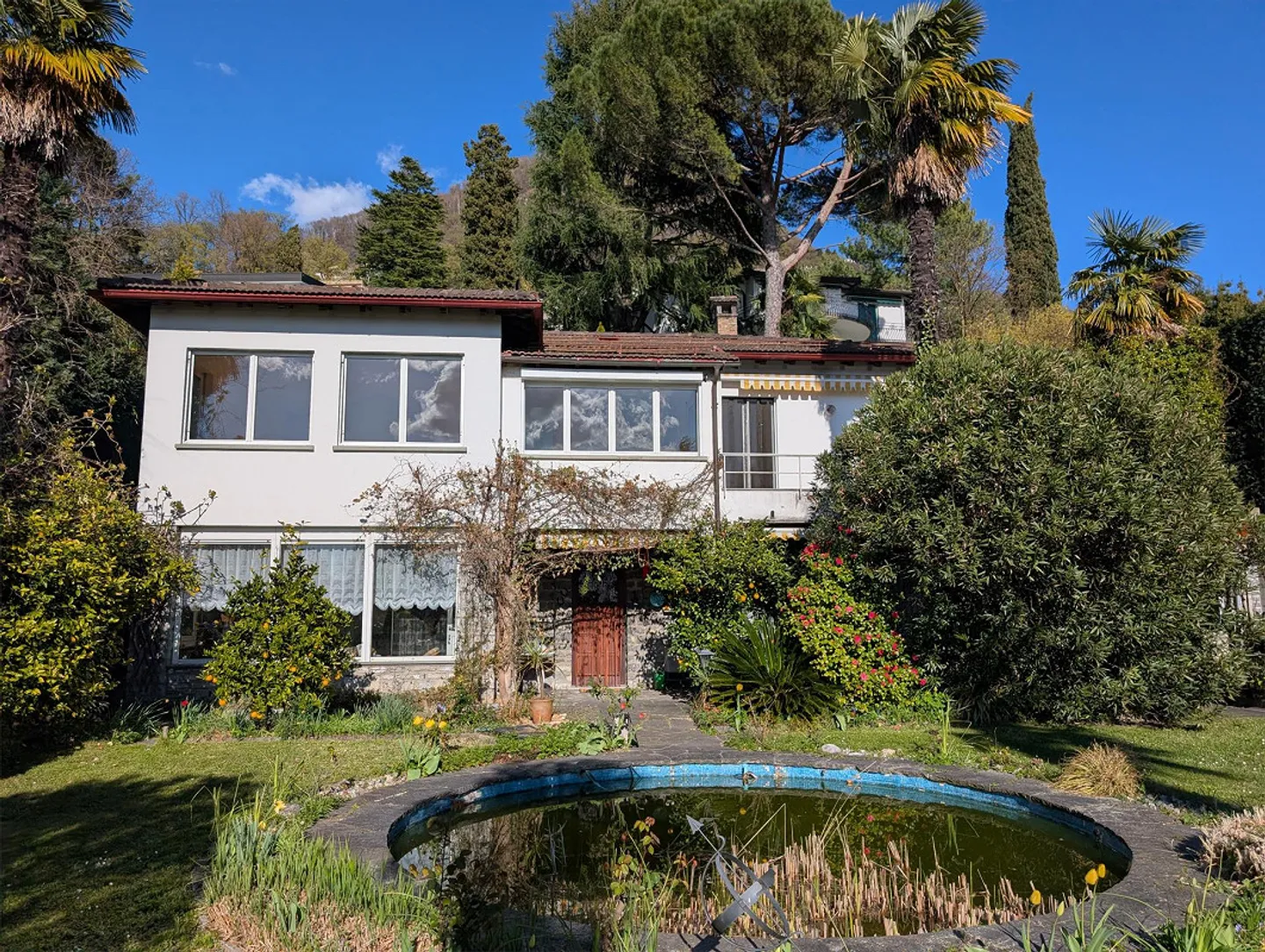 Luminoso appartamento di 4 stanze a Ruvigliana con vista sul lago - Foto 1 di 10