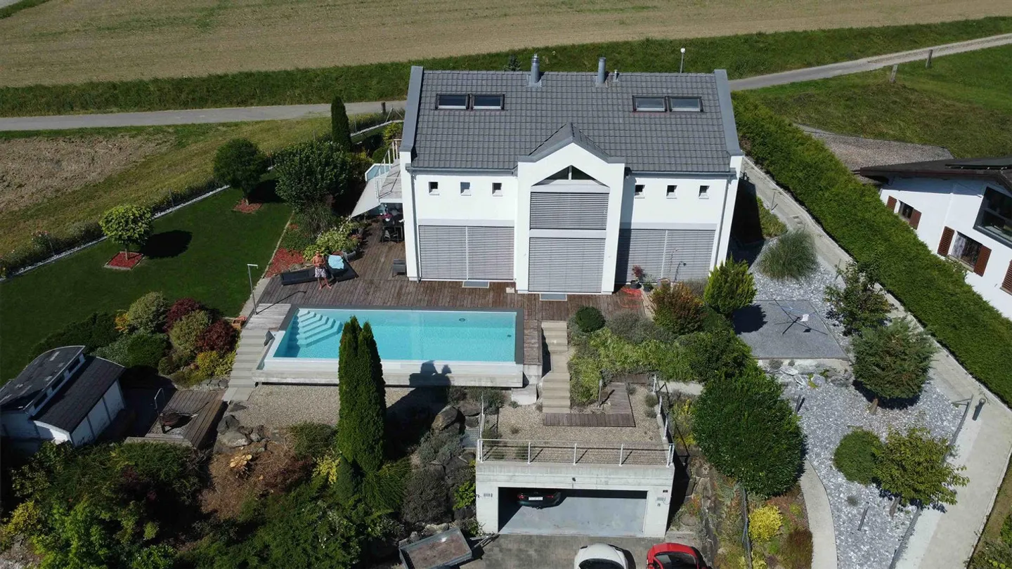 Modern single-family home in dream location with pool - Photo 1 of 26