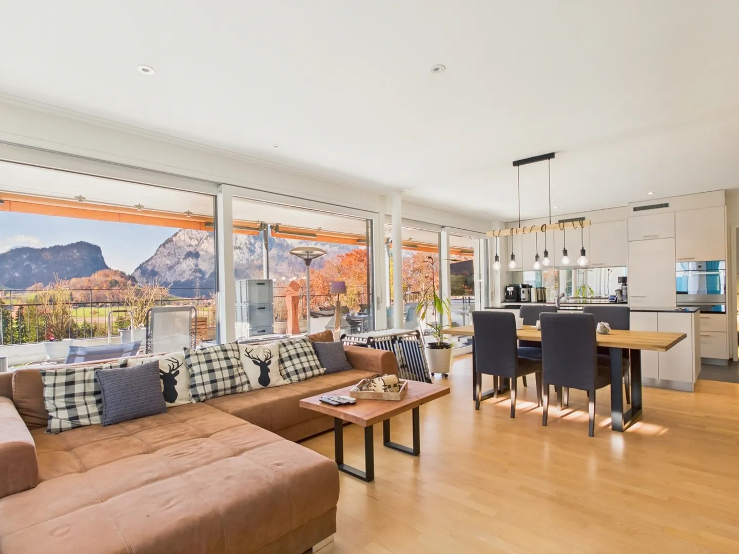 Huge panoramic terrace with mountain view, designer kitchen with cooking island, parking garage with e-charging station & outdoor parking! - Photo 1 of 11