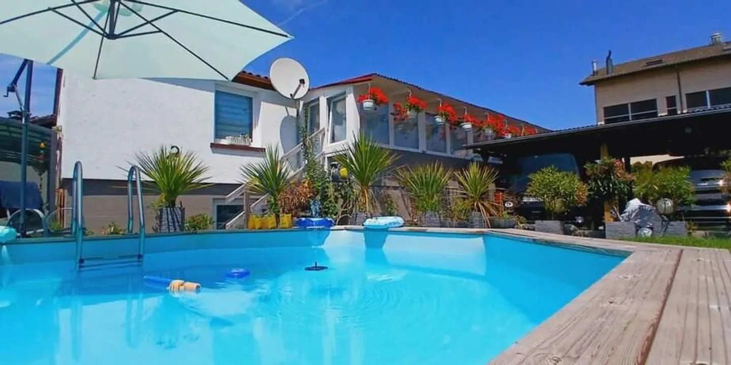 Charming Family Home with Pool - Photo 3 of 13