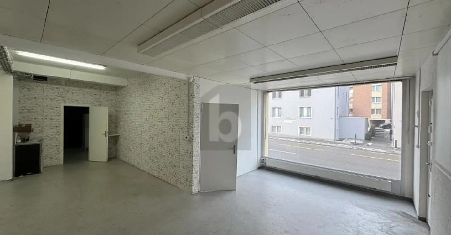 IN TOP LOCATION WITH LARGE DISPLAY WINDOW - Photo 2 of 5