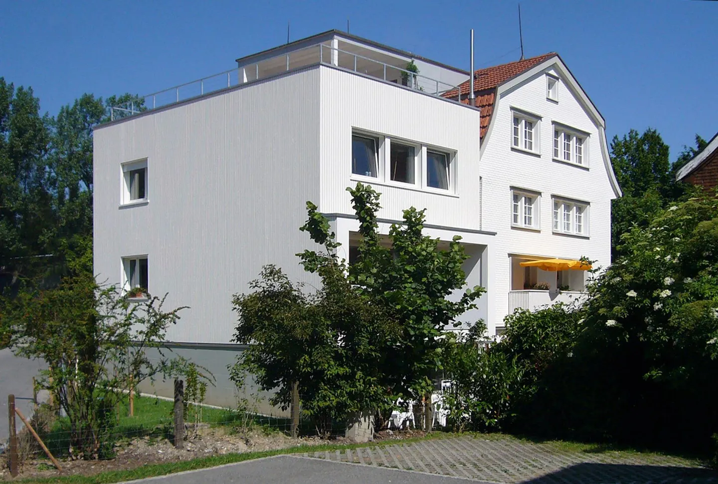 Section de maison avec jardin - Photo 1 sur 10