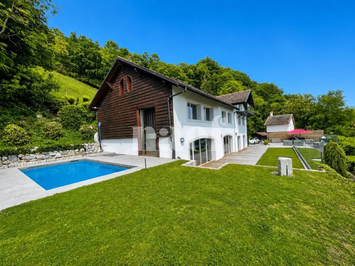 Extraordinary 8-Room Property with Panoramic Lake View and Heated Pool - Photo 2 of 13