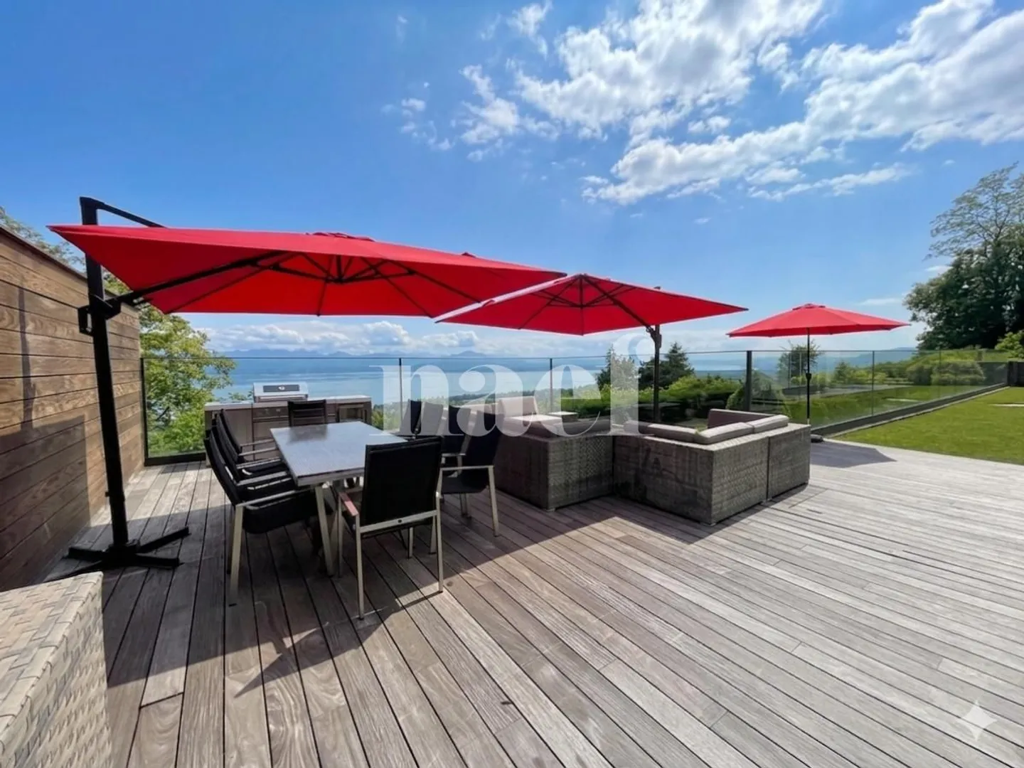 Extraordinary 8-Room Property with Panoramic Lake View and Heated Pool - Photo 3 of 13