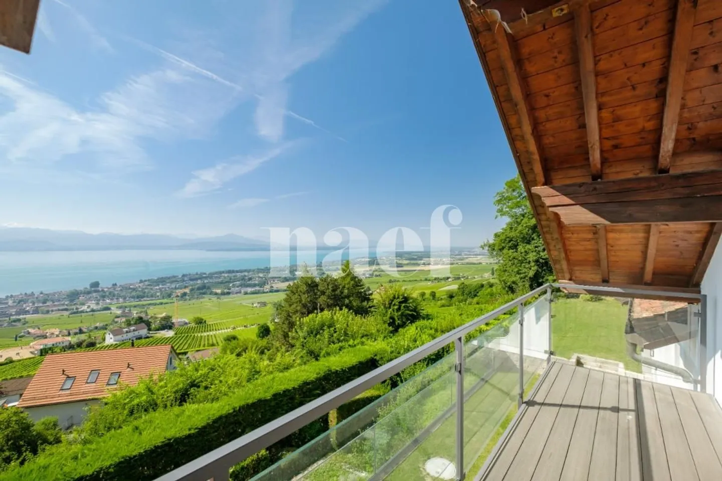 Extraordinary 8-Room Property with Panoramic Lake View and Heated Pool - Photo 7 of 13