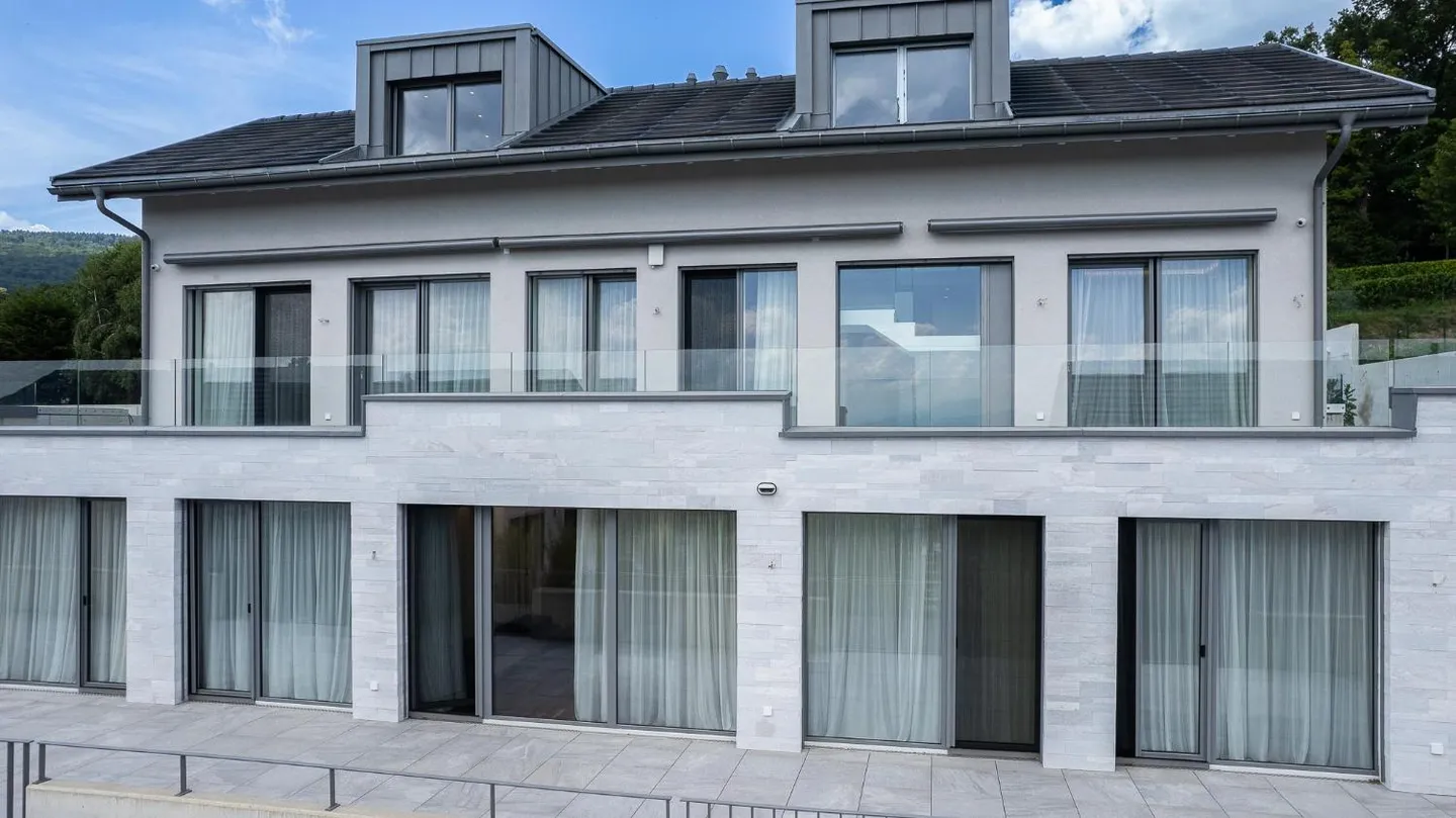 Villa contemporaine à Genolier - Photo 1 sur 19