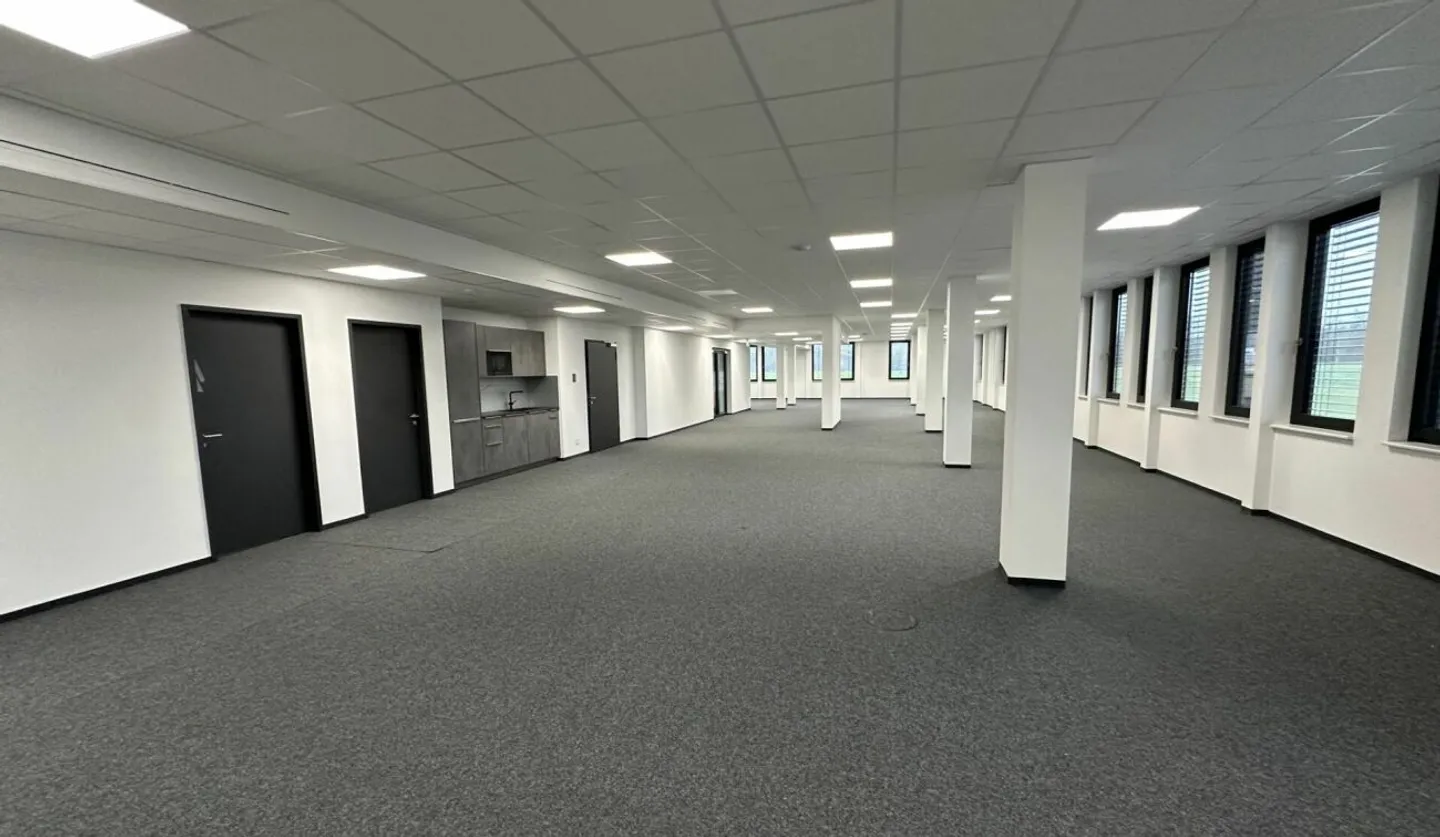 Welcome to the modern workspace with a view of greenery! - Photo 2 of 6