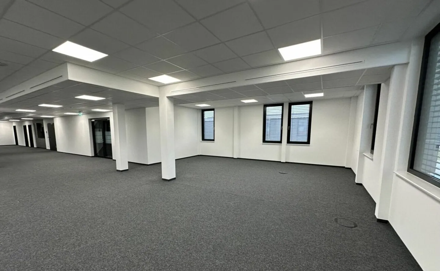 Welcome to the modern workspace with a view of greenery! - Photo 4 of 6