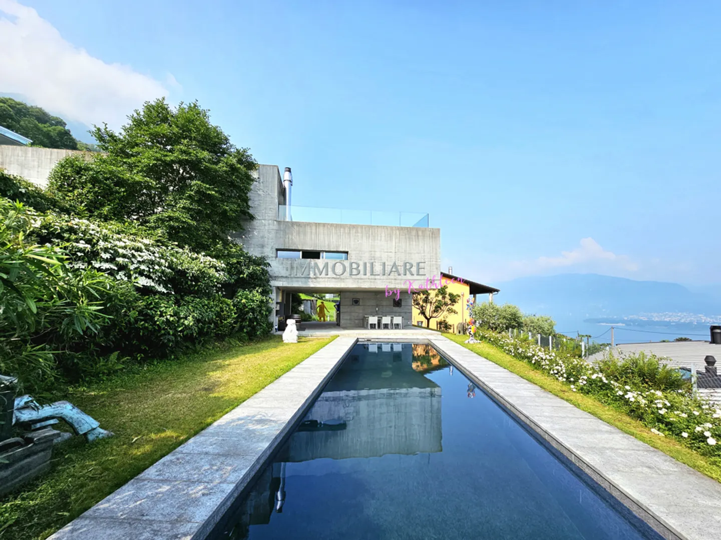 Villa with exposed concrete, panoramic lake view and sustainable features - Photo 1 of 15