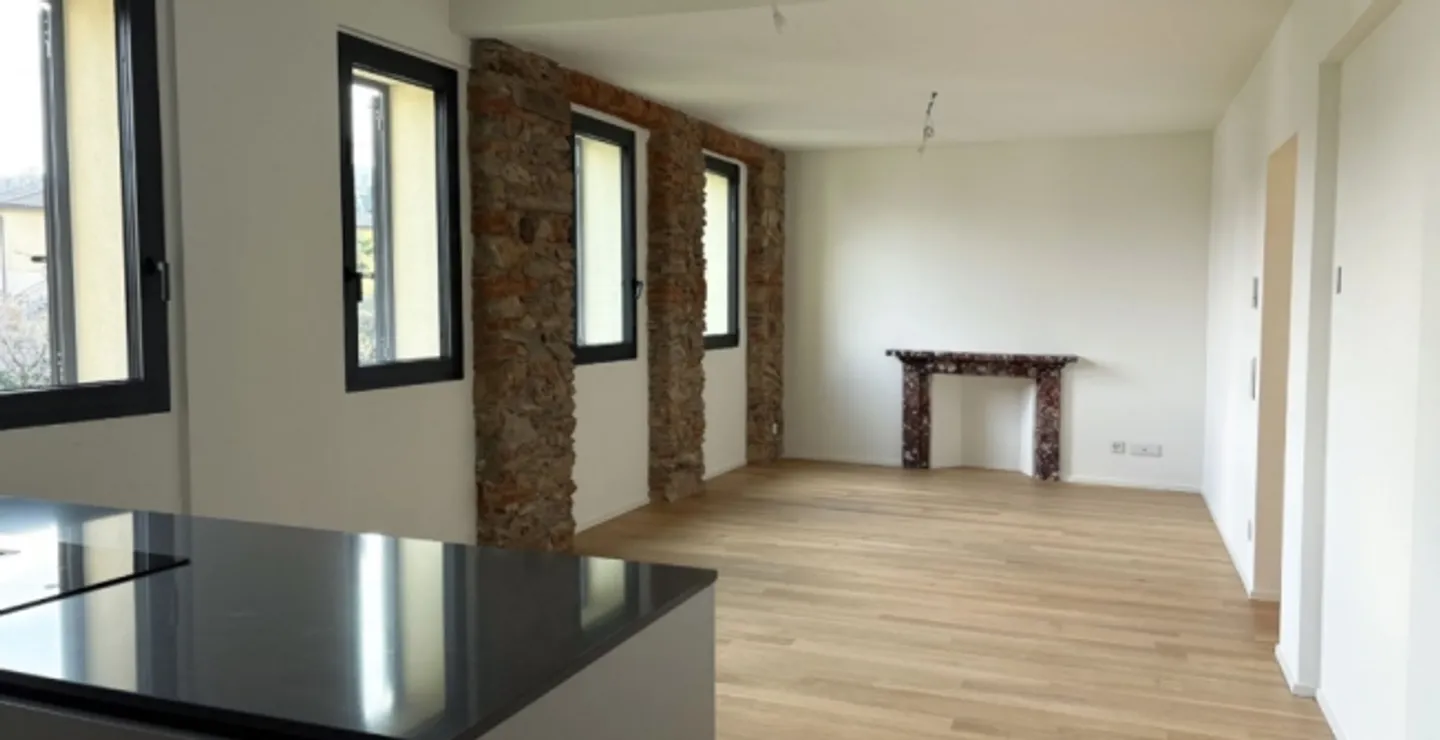 «Moderno Appartamento di 3.5 Locali al Piano Terra con Vista Lago a Pura – Comfort in Posizione Tranquilla» - Foto 1 di 5