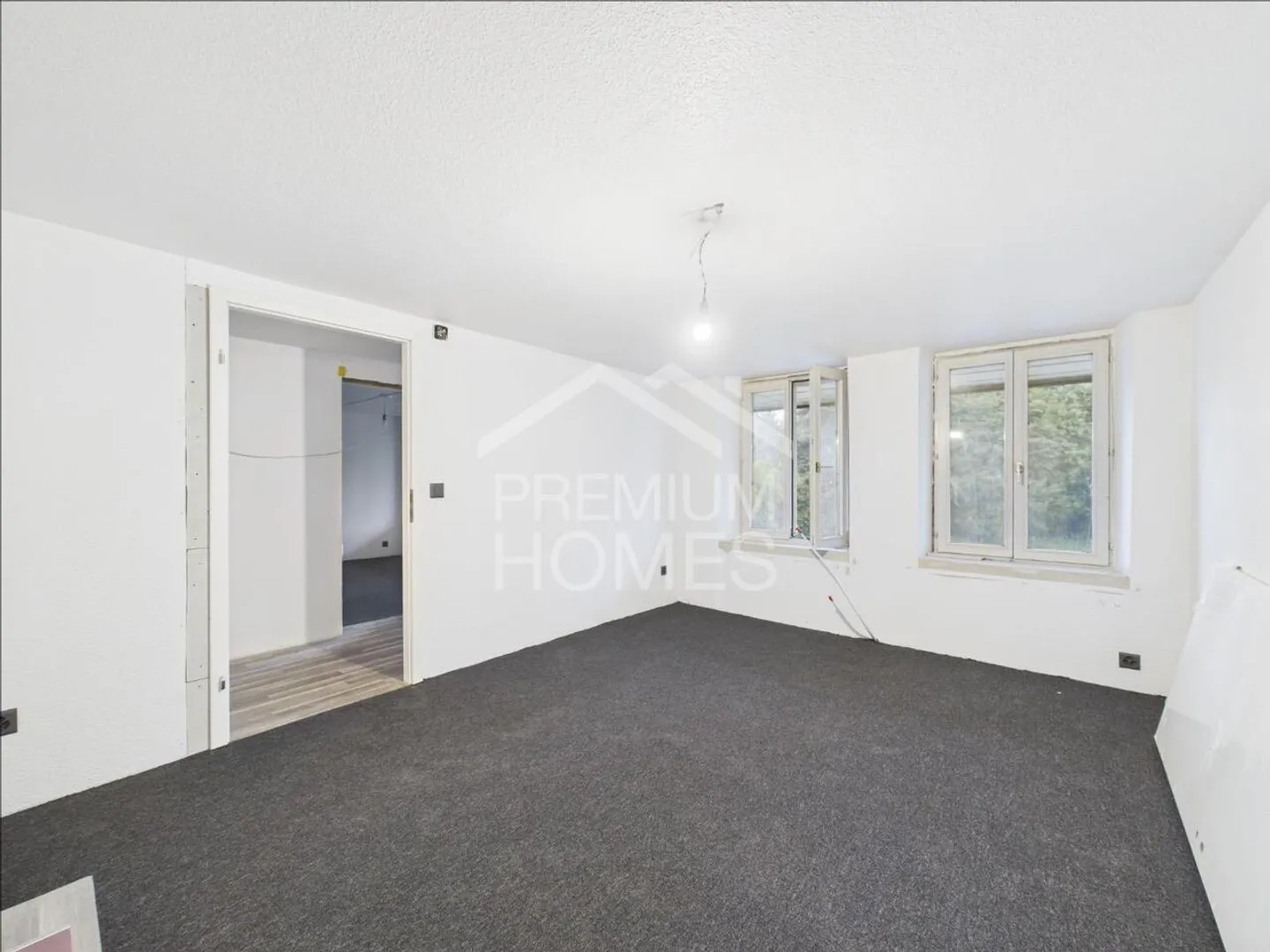 Vielseitiges Mehrfamilienhaus mit Ausbaupotenzial und bewilligter E... - Foto 10 von 13