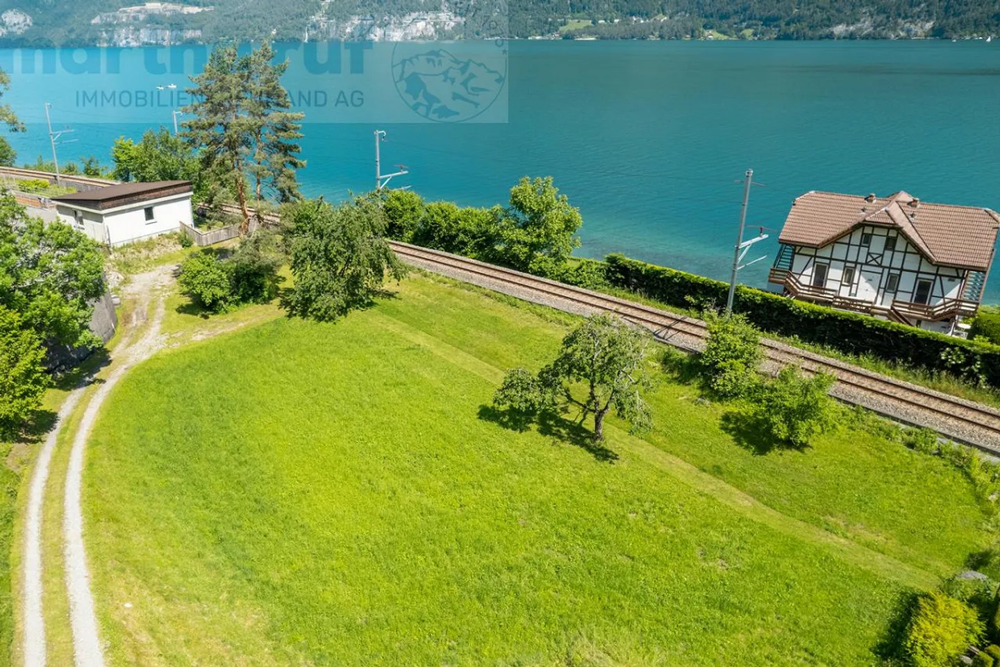 Baulandparzelle mit Seezugang - Foto 4 von 11