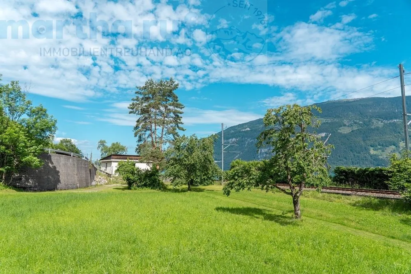 Baulandparzelle mit Seezugang - Foto 7 von 11